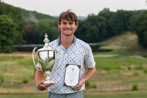 golfer holding trophy