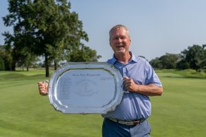 golfer holding trophy