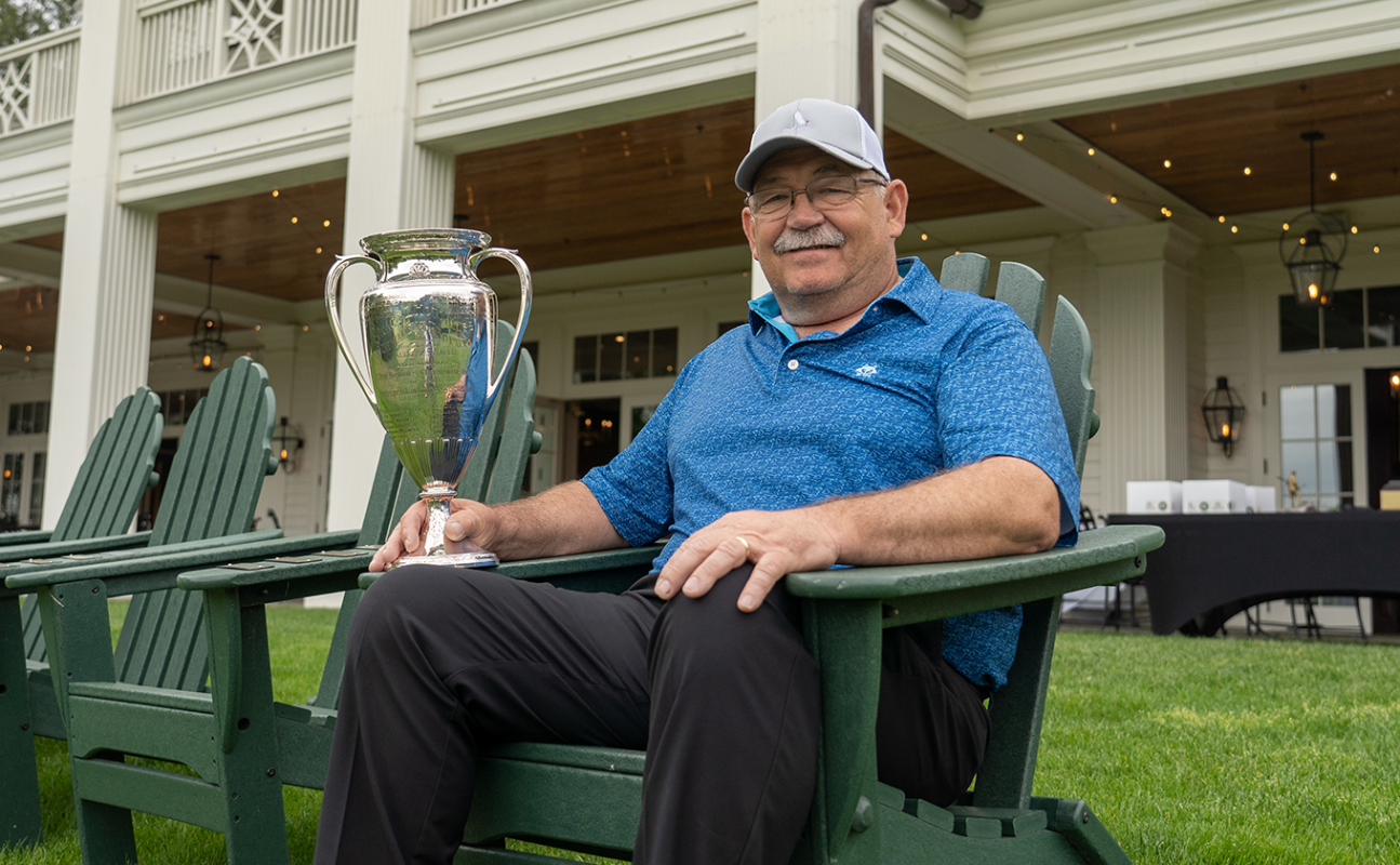 Roddy McRae with the MGA Senior Amateur trophy with MGA signage